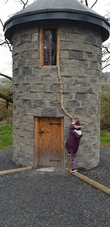 Megan trying to climb tower 